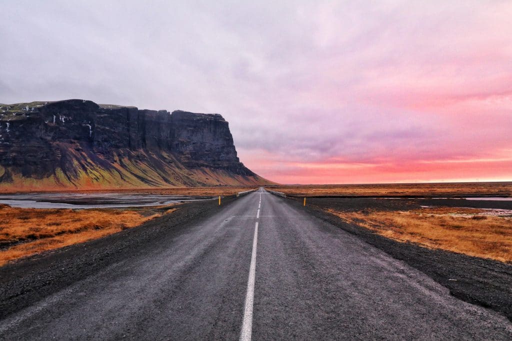 Route 1 in the south coast of Iceland during a pink sunset