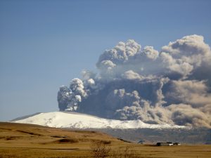 Eyjafjallajökull Eruption with a tall ash cloud on a clear sky