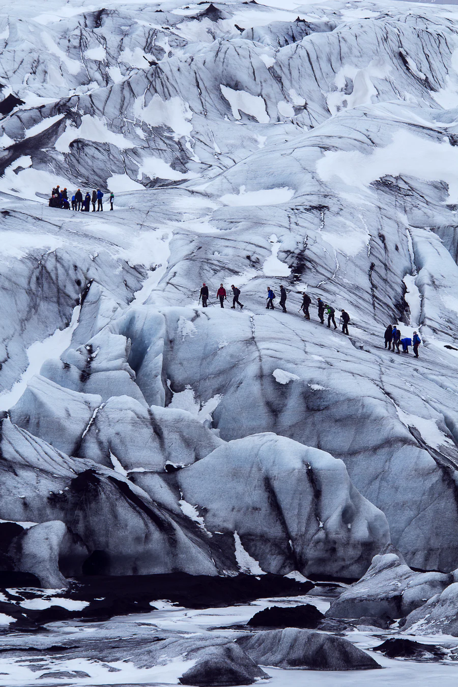 People trekking on Langjökull glacier on a glacier hiking tour