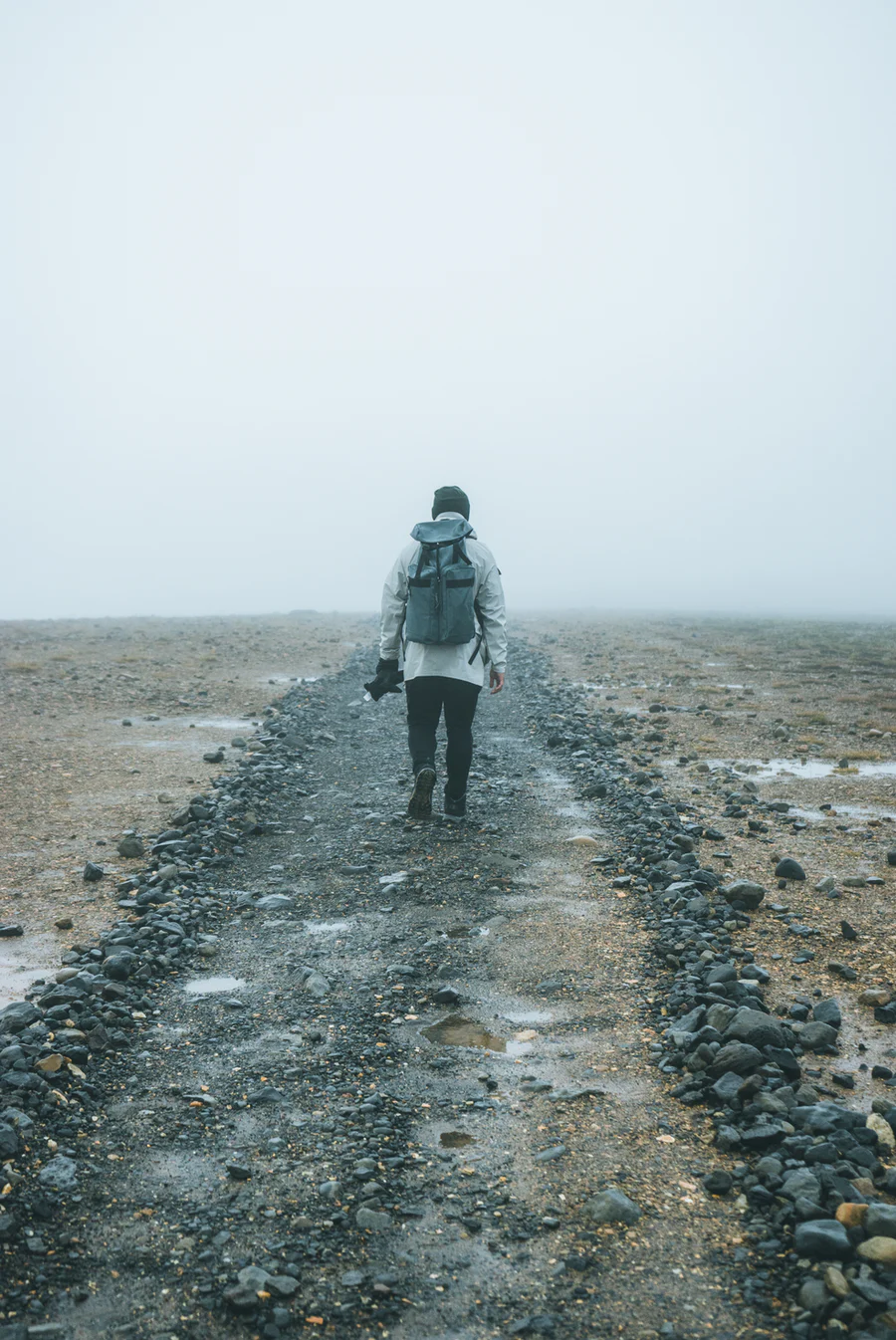 A person hiking through the Icelandic Highlands with low mist