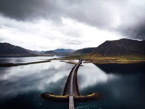 A road through the sea and mountains in West Iceland