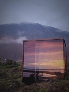 glass sauna with mt.Hafnarfjall in background